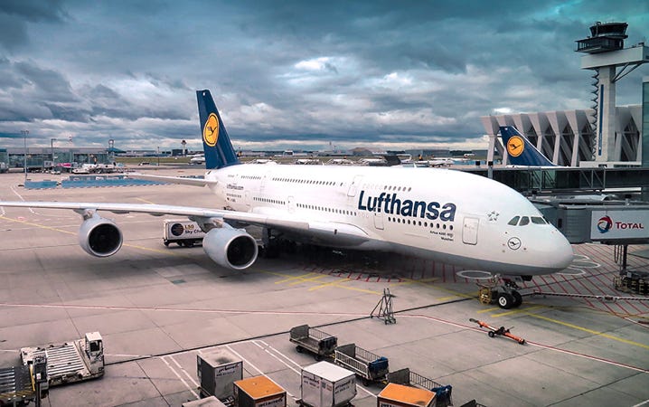 Image of a passenger aircraft docked at the airport