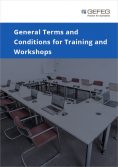 As an illustration of the topic of trainings and workshops, a training room with unfolded laptops is shown.