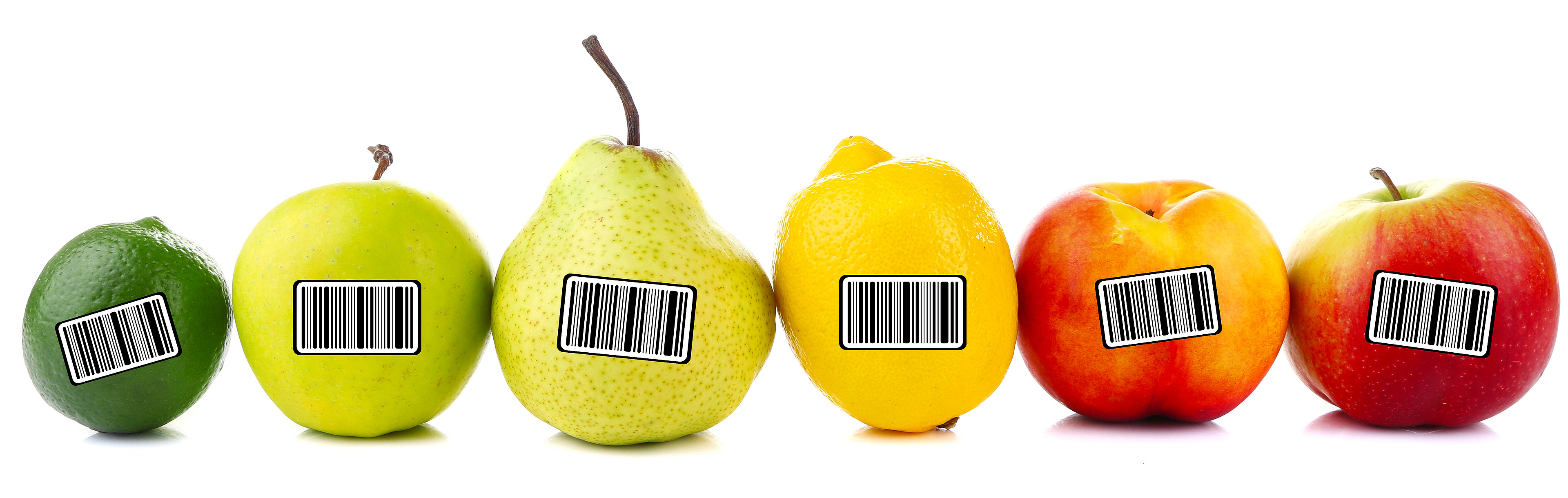 The picture shows a row with different fruits, each with a sticker with a barcode on it.